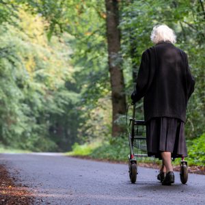 old lady walking with rollator