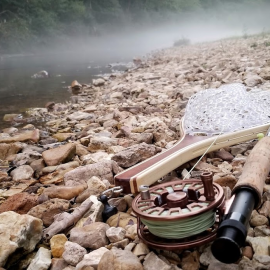 A fly rod on the banks of a misty creek. Image by Sandi Troup