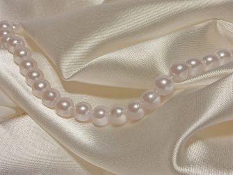 Pearls on satin clothes. Img by Mastinos. https://every1dies.org