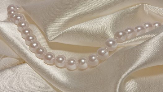 Pearls on satin clothes. Img by Mastinos. https://every1dies.org