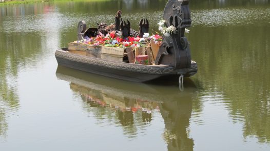 Funerals can be simple or elaborate, such as this floating viking-style barge