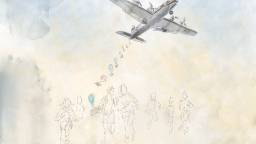 A USAF C-54 bomber dropping candy for children who are running enthusiastically to meet the packages.