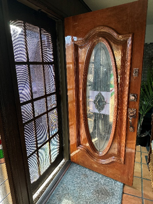 A wooden front door with stained glass that Marianne has been refinishing. #impossiblethings