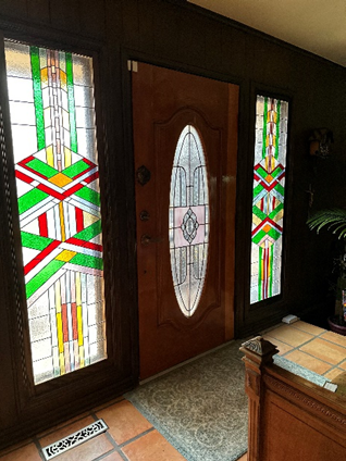 A wooden front door with stained glass that Marianne has been refinishing. #impossiblethings