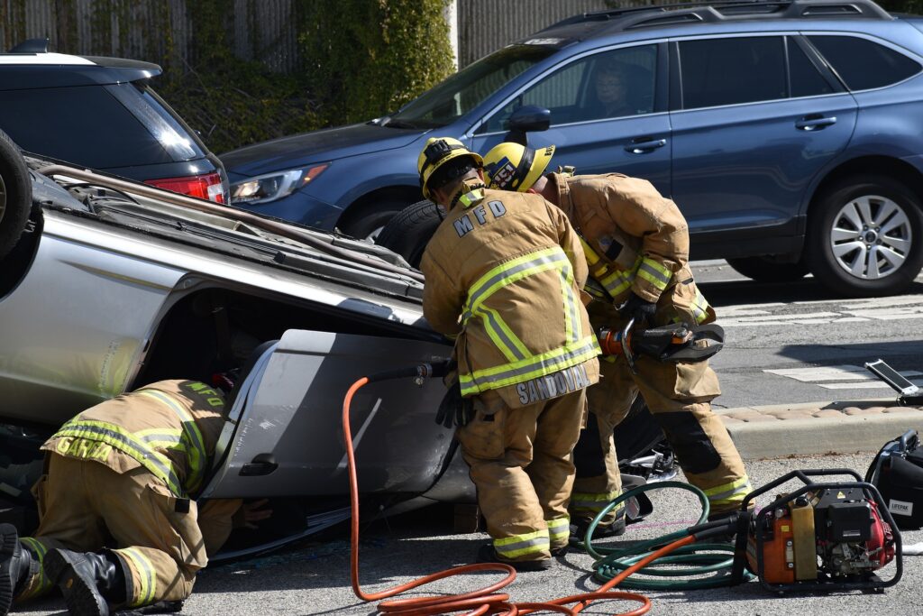 Firemen extracting a victim from an overturned car. We talk about traumatic grief in this episode, which can result when someone dies unexpectedly