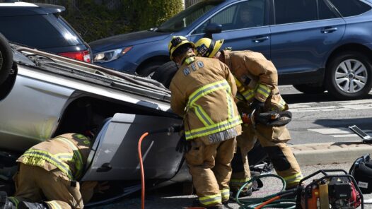 Firemen extracting a victim from an overturned car. We talk about traumatic grief in this episode, which can result when someone dies unexpectedly