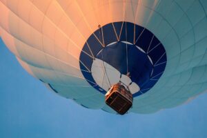 Looking up at a hot air balloon. A palliative care team can give the support for a patient and family to rise above the circumstances of their illness