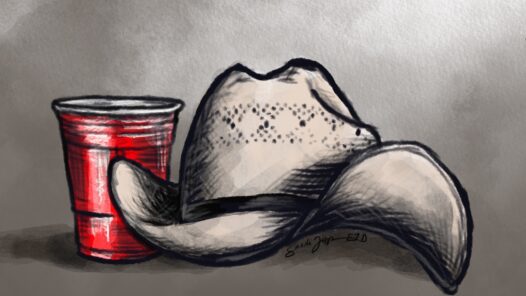 Toby Keith's straw cowboy hat next to a red solo cup.