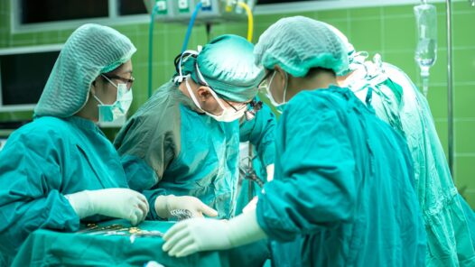 An operating room team. We talk about surgery and cancer treatment options in this S6E1 episode https://every1dies.org