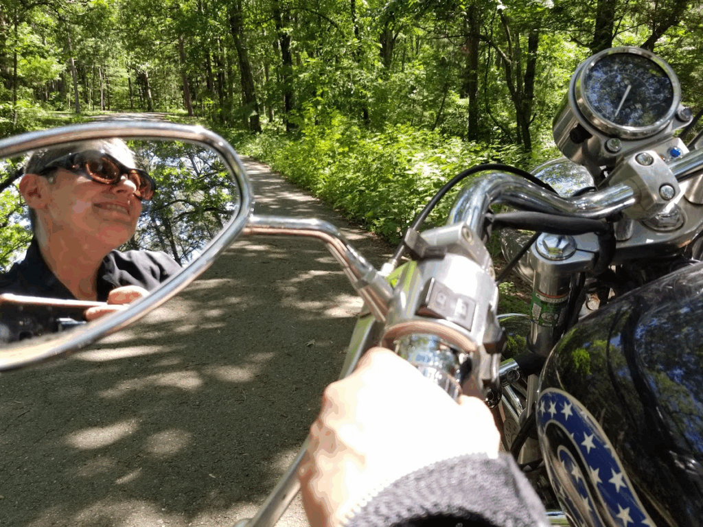The author riding a motorcycle on a scenic Ozark byway